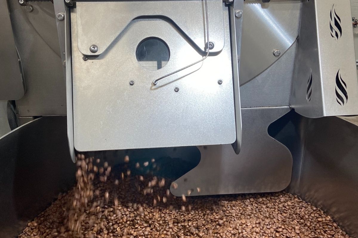 Motobean Coffee Roasters Loring Roaster.  Freshly Roasted Beans dropping into cooling tray after roast.